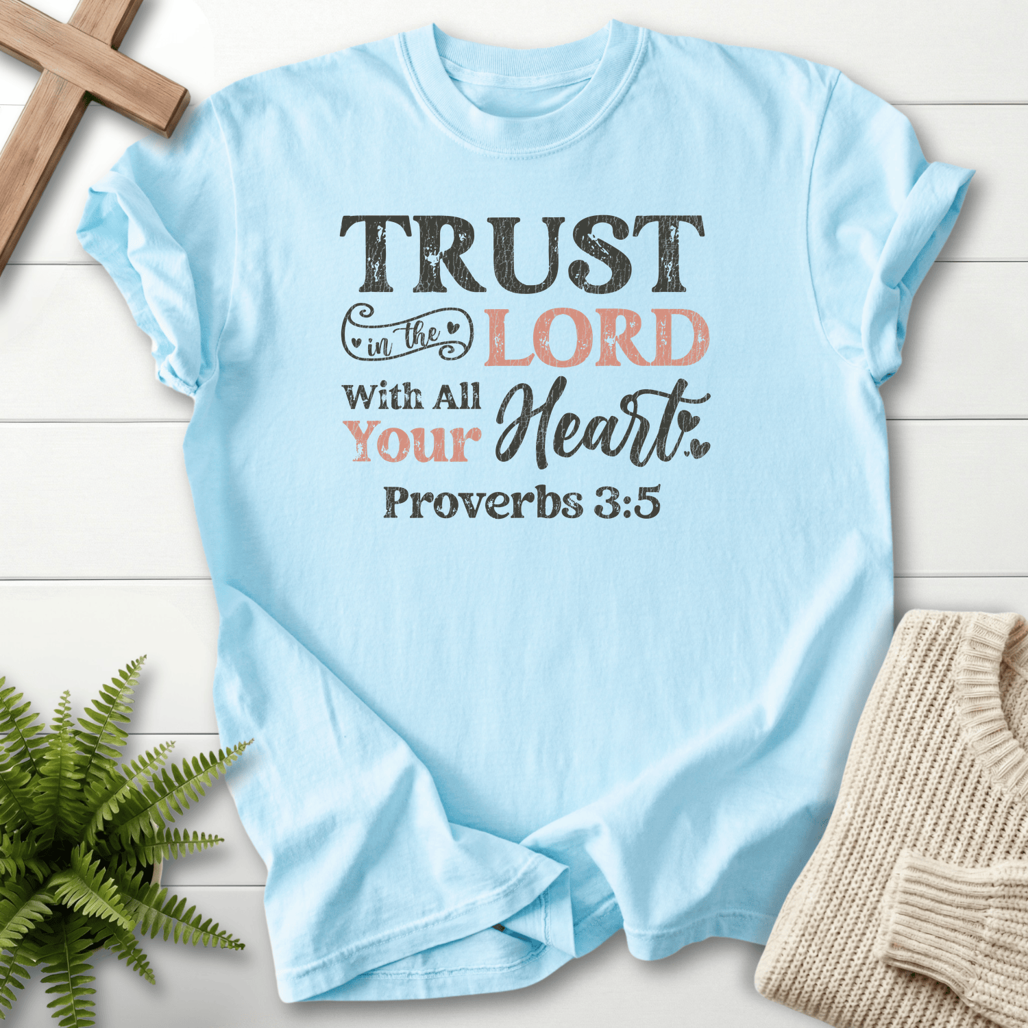 Chambray Christian t-shirt for women with bold layered Trust in the Lord With All Your Heart typography, inspired by Proverbs 3:5.