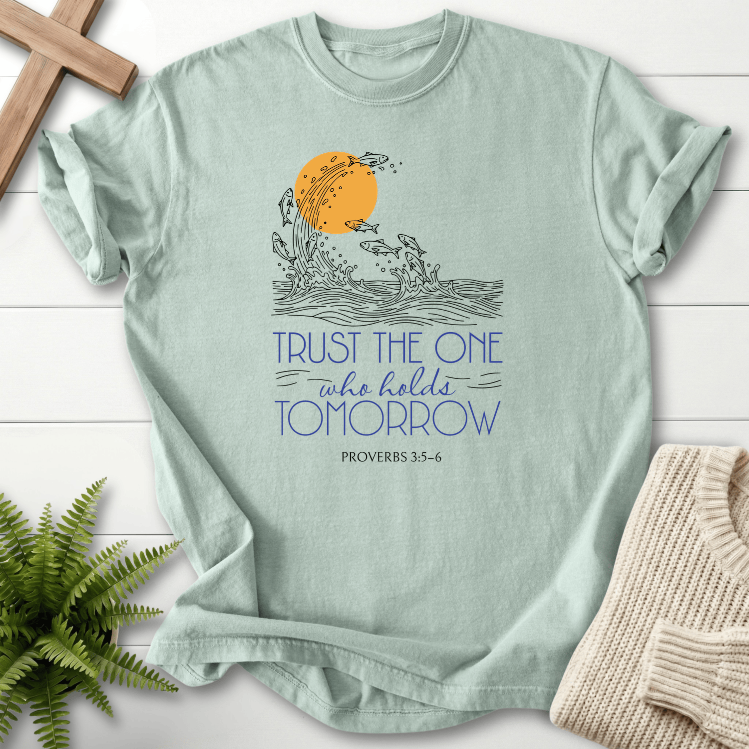 Bay Christian t-shirt for women with fish and a golden sun illustration and Trust the One who holds Tomorrow, inspired by Proverbs 3:5-6.