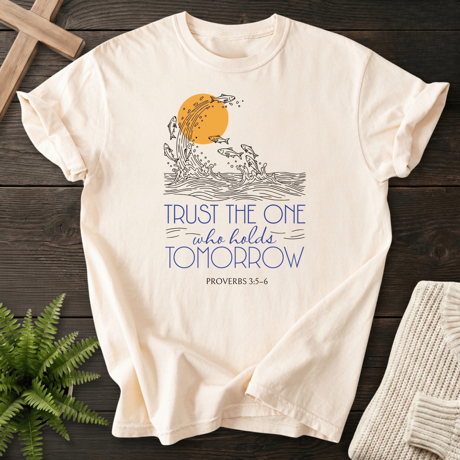 Ivory Christian t-shirt for women with an ocean and sun graphic, inspired by Trust the One who holds Tomorrow and Proverbs 3:5-6.