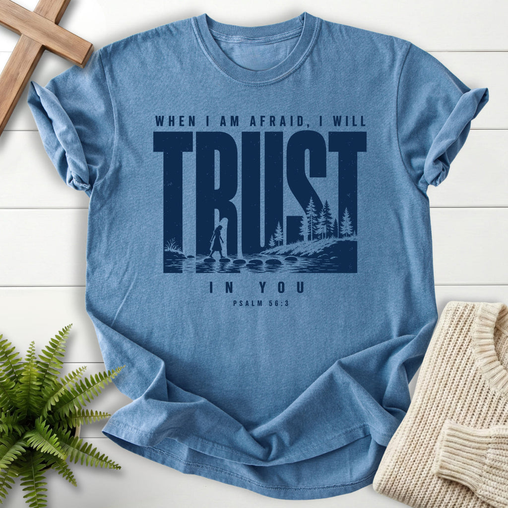 Flatlay of a Blue Jean faith-based tee with "Trust When I am Afraid T-Shirt" Psalm 56:3.