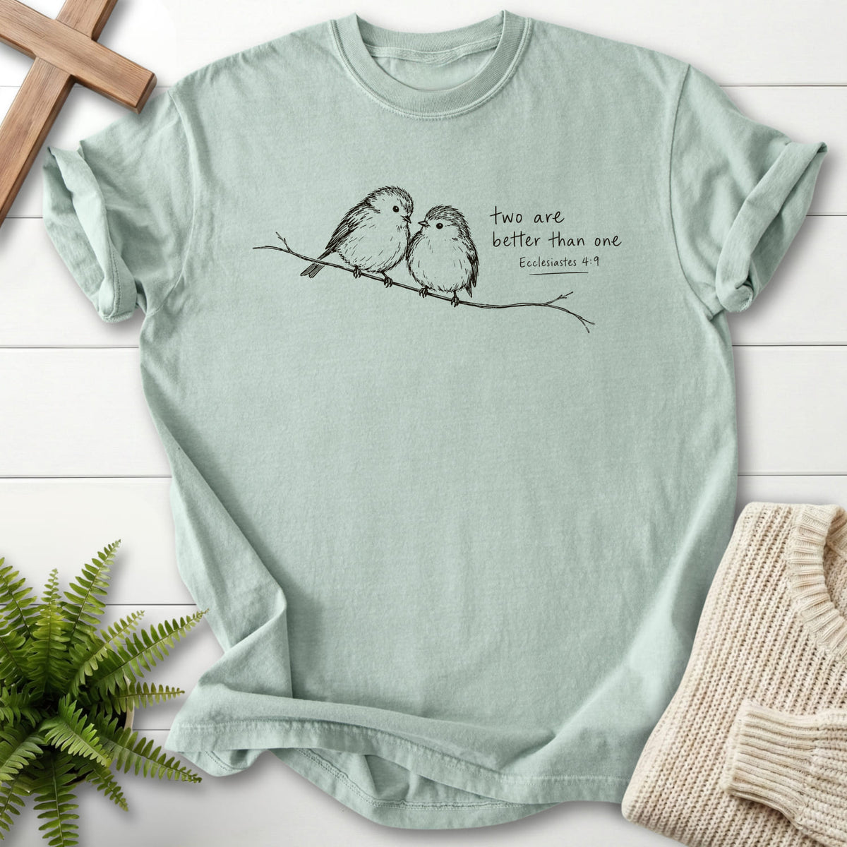 Flat lay of a Bay Bible verse tee featuring "Two Are Better Than One T-Shirt" Ecclesiastes 4:9.