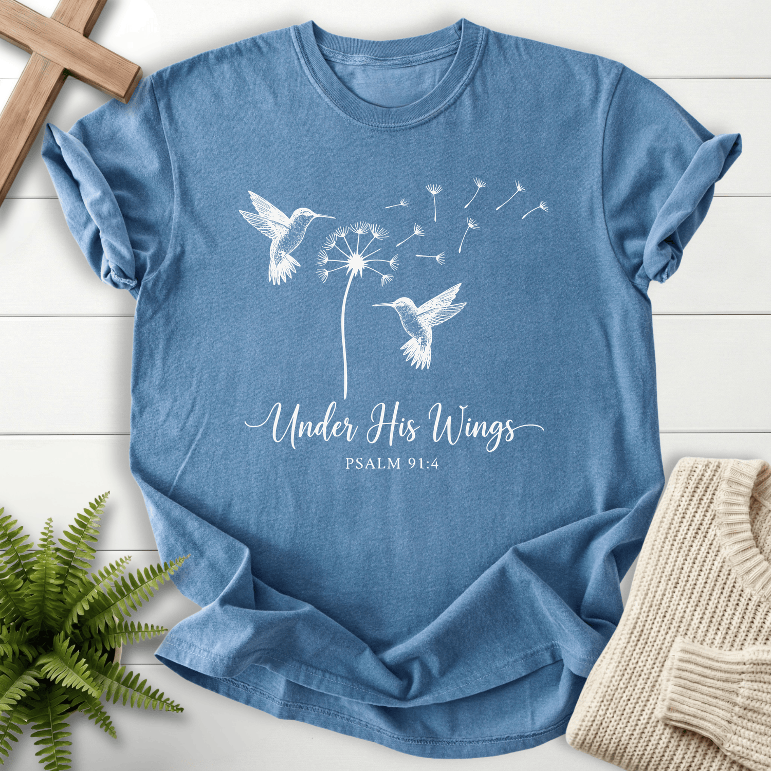 Blue Jean Christian t-shirt for women with hummingbirds and dandelion line art and Under His Wings text, inspired by Psalm 91:4.