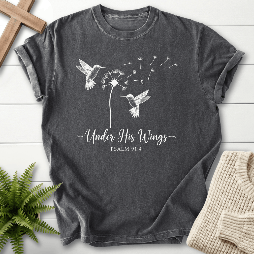 Pepper Bible verse tee with line art hummingbirds and a seed-blown dandelion, Comfort Colors 1717, inspired by Psalm 91:4.