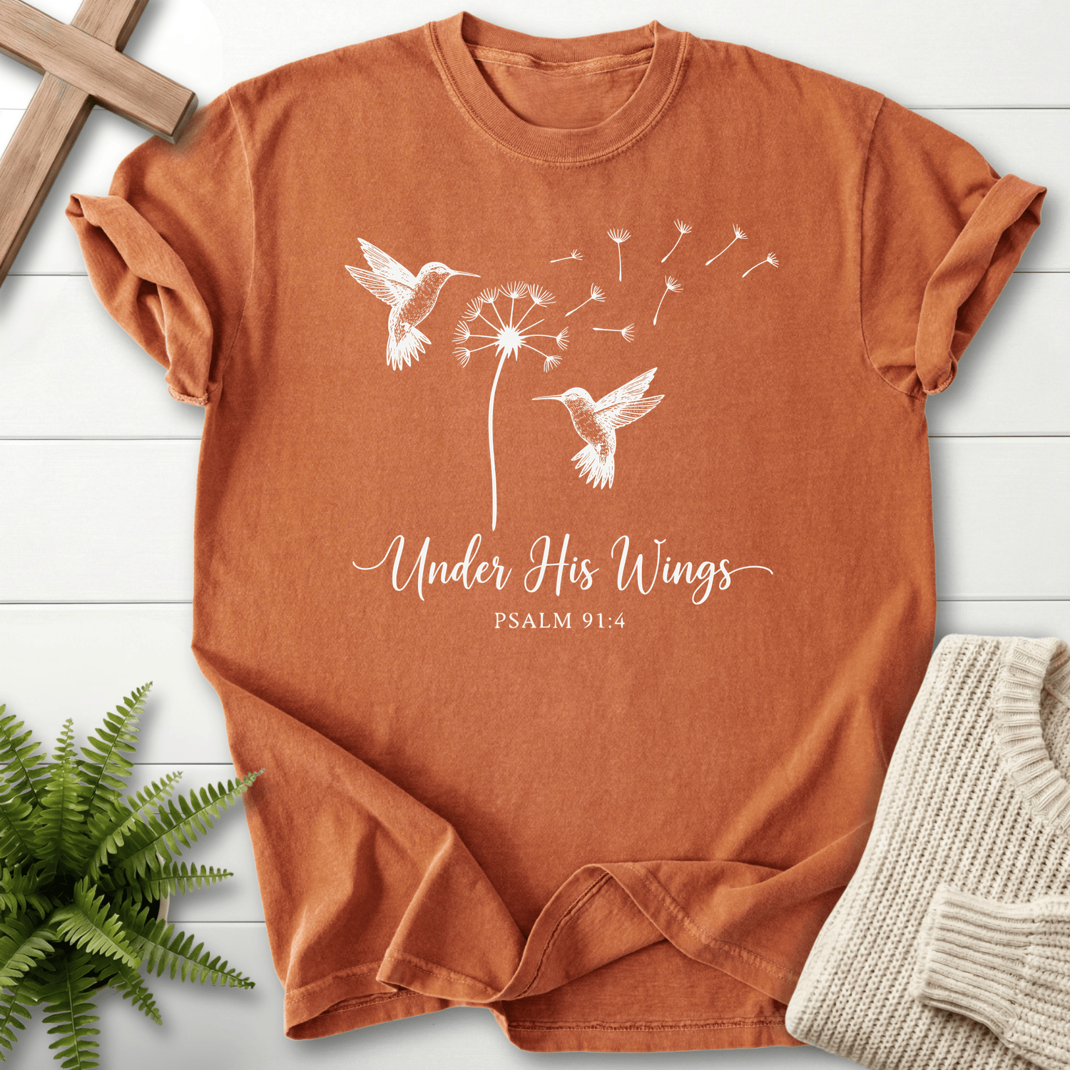 Yam Christian t-shirt for women with hummingbirds flanking a dandelion and Under His Wings lettering, inspired by Psalm 91:4.