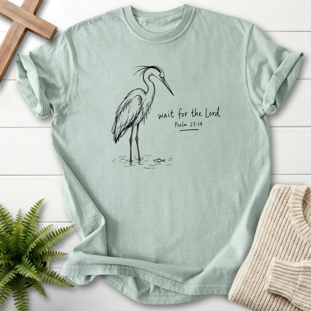 Flat lay of a Bay women's Christian tee featuring "Wait for the Lord Bird T-Shirt" Psalm 27:14.