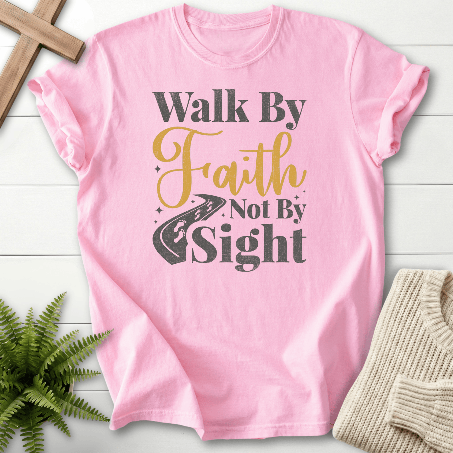 Blossom faith-based tee with mixed-font Walk By Faith Not By Sight text and a winding road, inspired by 2 Corinthians 5:7.
