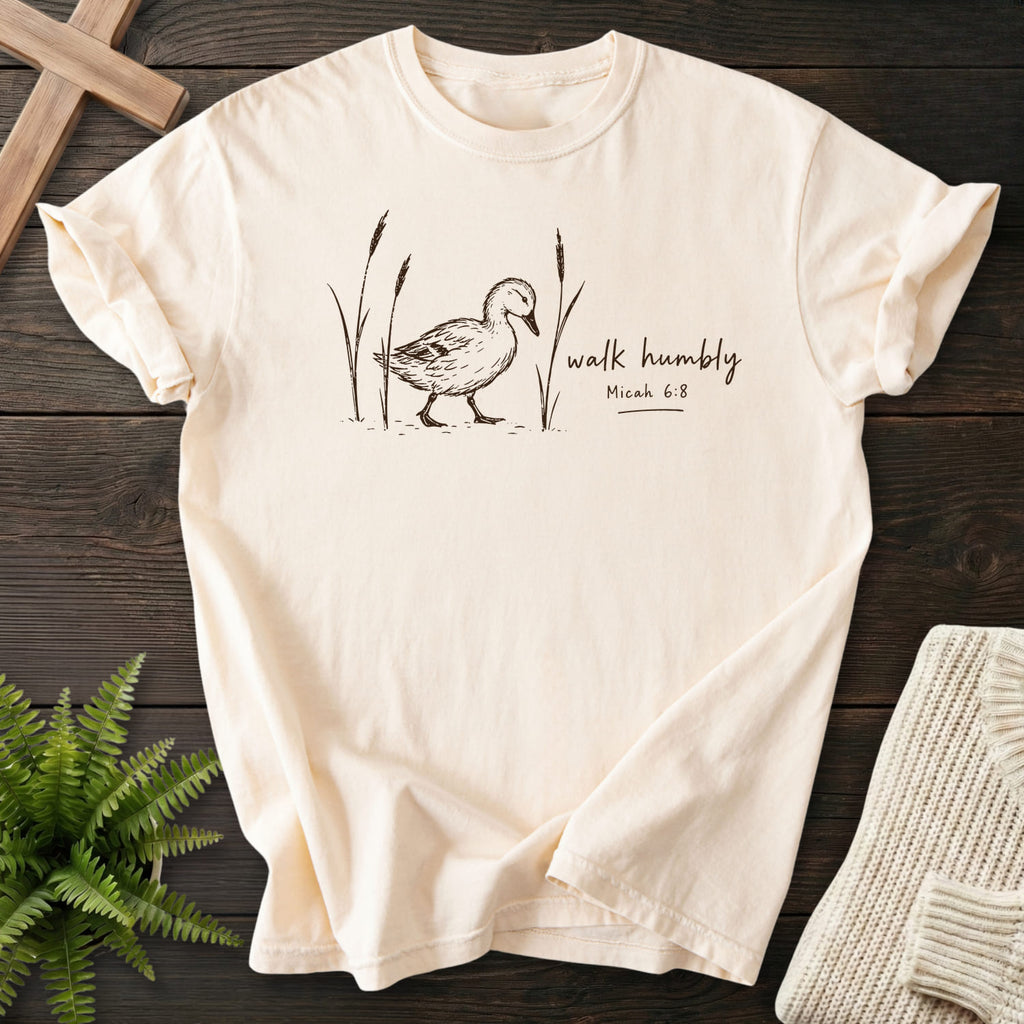 Flatlay of an Ivory Christian graphic tee with "Walk Humbly Duck Micah 6:8 T-Shirt" Micah 6:8.