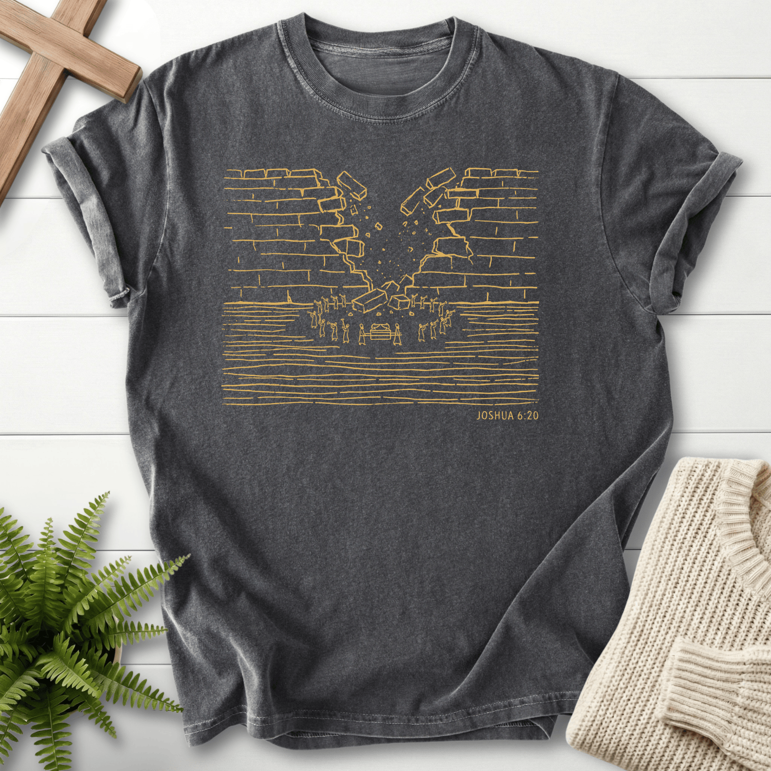 Pepper Christian t-shirt for women with gold line art of the Walls of Jericho crumbling, inspired by Joshua 6:20.
