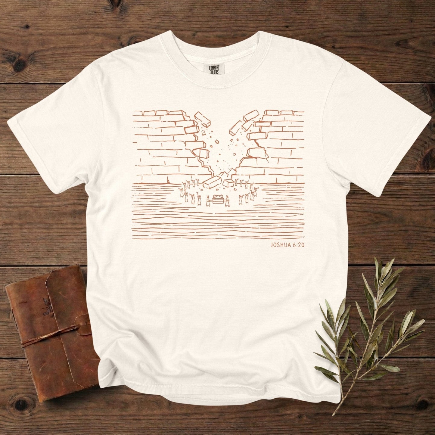 Comfort Colors 1717 ivory Christian women tee showcasing a minimalist wall-of-Jericho artwork based on Joshua 6:20, drawn in warm line-art. A stylish scripture-rooted T-shirt for US faith wear, perfect for Christian women who enjoy subtle Bible-story designs.