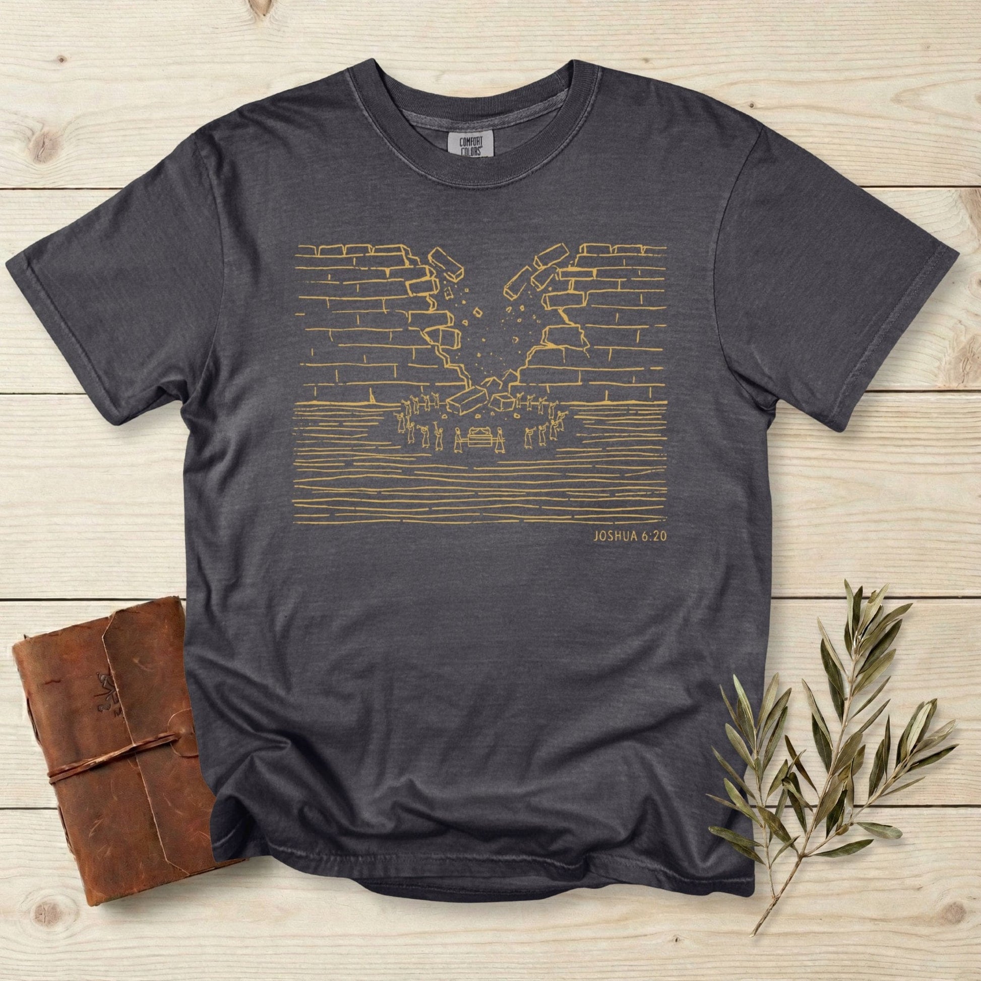 Comfort Colors 1717 pepper grey Christian women tee featuring a minimalist line-art depiction of the walls of Jericho collapsing, inspired by Joshua 6:20. Simple faith-based artwork on a vintage garment-dyed T-shirt, perfect for US faith wear and scripture apparel.