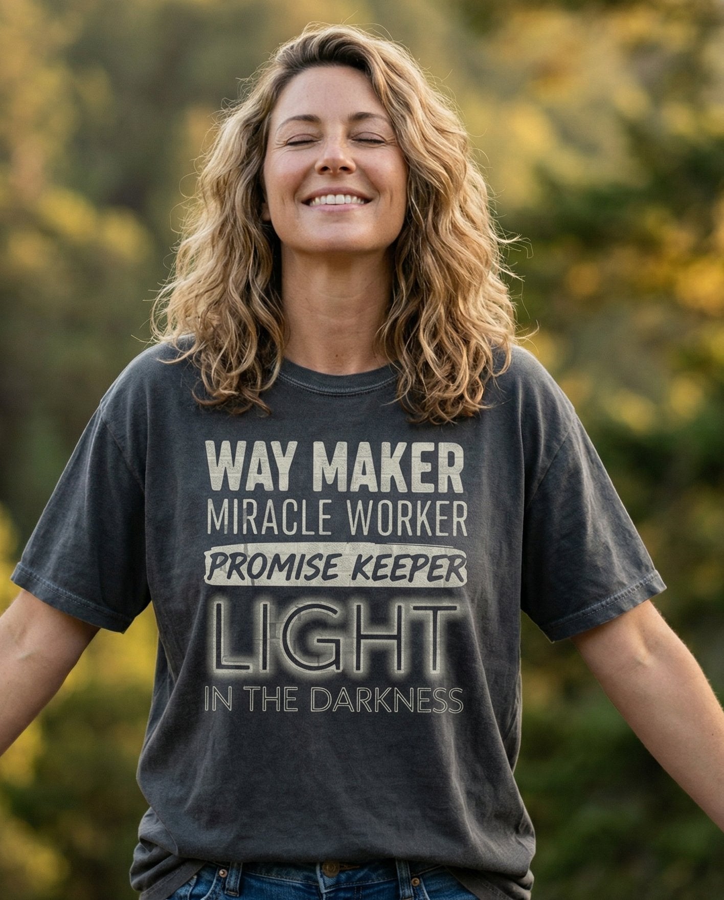 Waymaker T-shirt – Pepper women's Christian tee, lifestyle photo in nature trail – Grunge bold stacked text design reading 'Way Maker – She Wears Faith