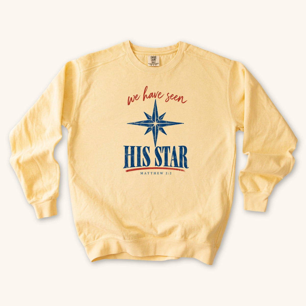 Butter Christian Christmas sweatshirt with We Have Seen His Star lettering, an eight-pointed star and Matthew 2:2.