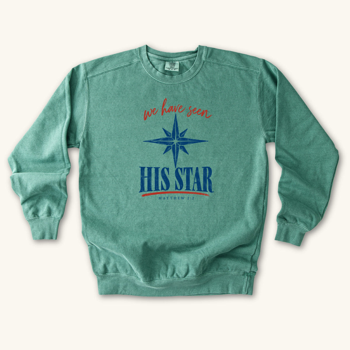 Light Green Christian Christmas sweatshirt with We Have Seen His Star lettering, an eight-pointed star and Matthew 2:2.