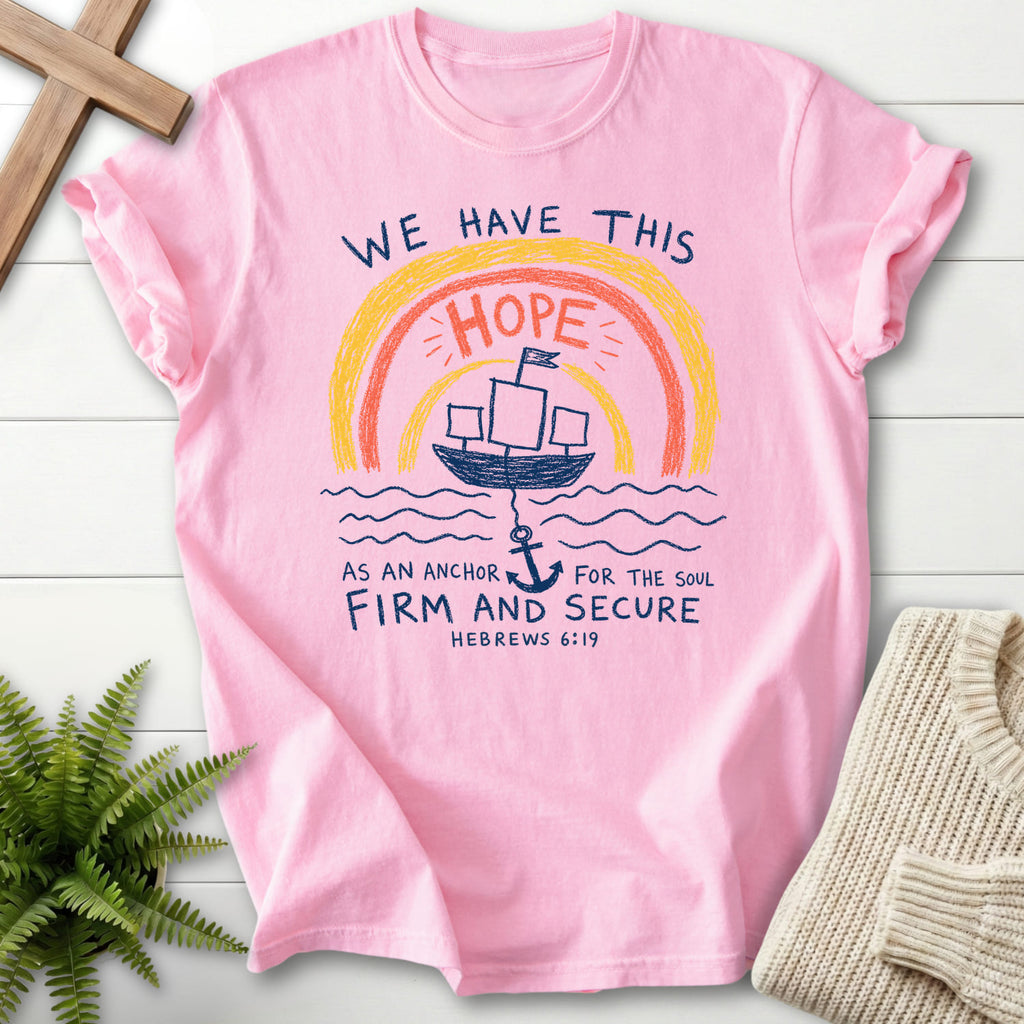 Flatlay of a Blossom Comfort Colors 1717 Christian t-shirt for women with "WE HAYE THIS T-Shirt" Hebrews 6:19 From Printify.