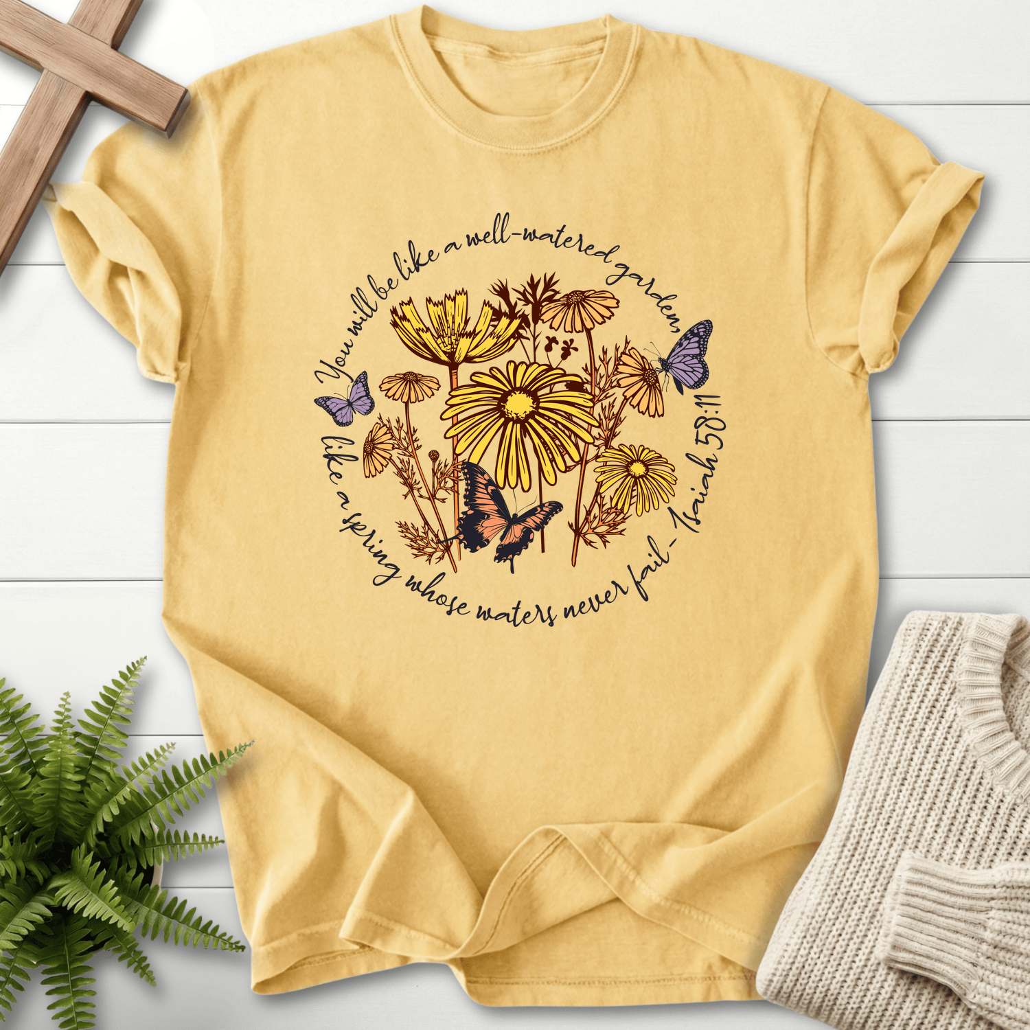 Butter Christian t-shirt for women with a botanical wildflower circle, inspired by Isaiah 58:11.