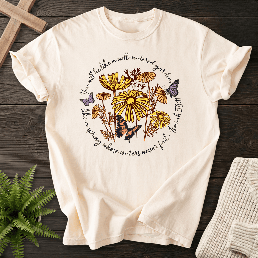 Ivory Christian t-shirt for women with a circular wildflower and butterfly botanical design, inspired by Isaiah 58:11.