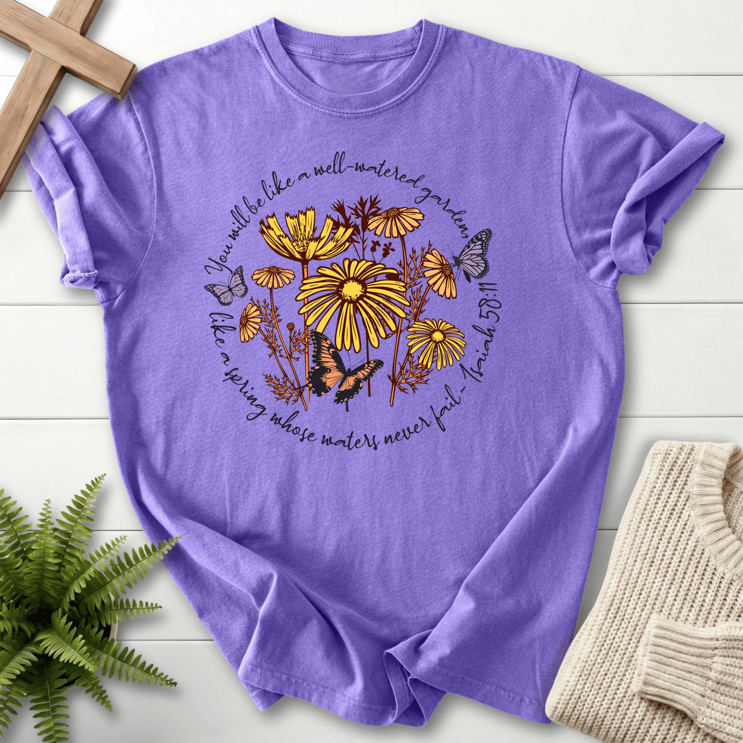 Violet Bible verse tee with a Well-Watered Garden wildflower wreath, inspired by Isaiah 58:11.