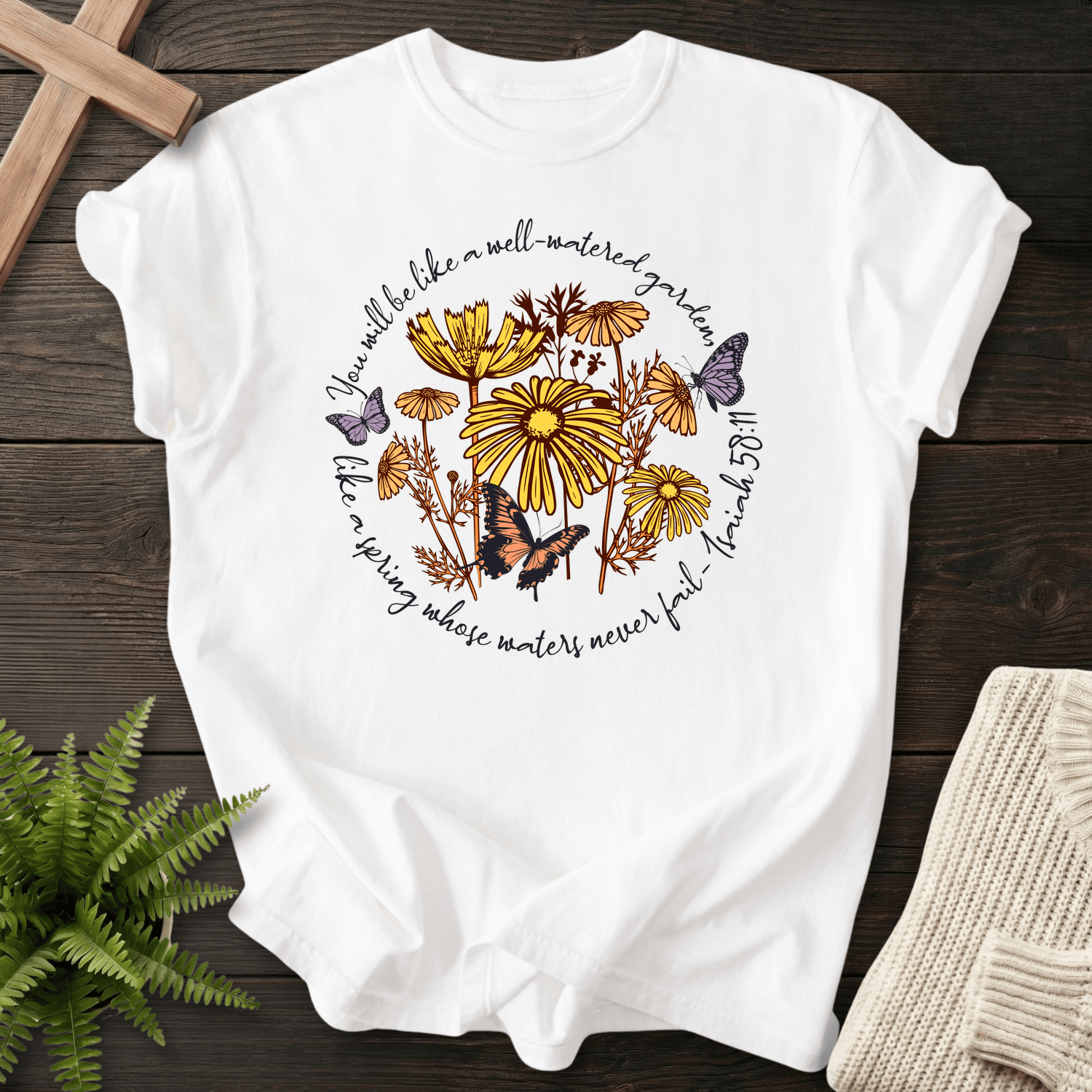 White Christian t-shirt for women with a butterfly and daisy motif, inspired by Isaiah 58:11.