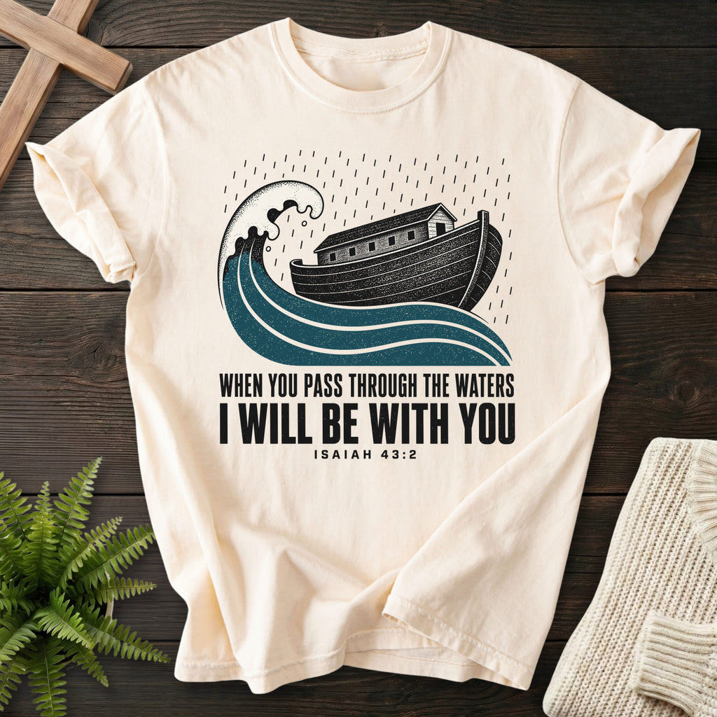 Flatlay of an Ivory Christian shirt with "When You Pass Through The Waters T-Shirt" Isaiah 43:2.