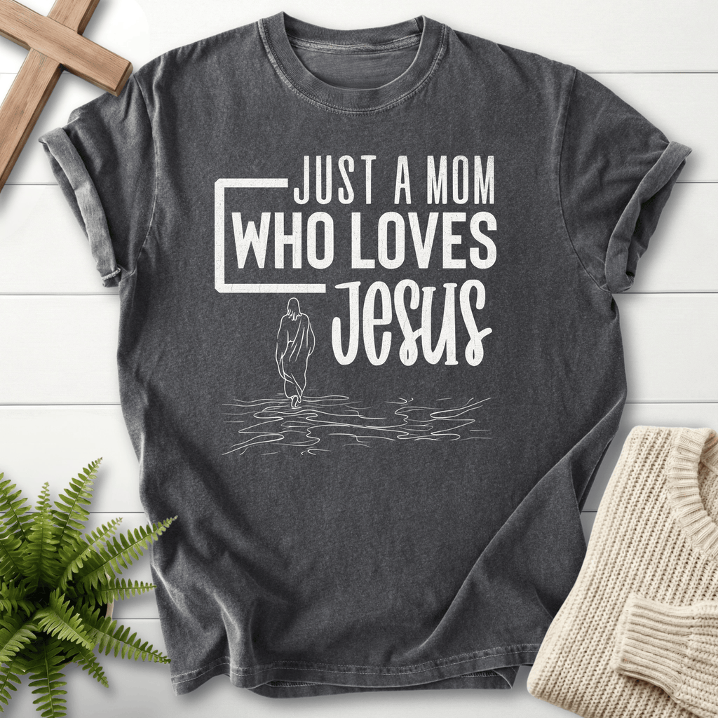 Pepper grey women's faith t-shirt with 'Just a Mom Who Loves Jesus' bold text and line-art figure.