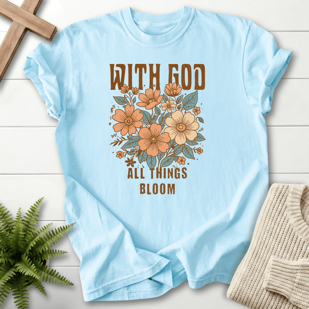 Chambray Bible verse tee with With God All Things Bloom and an earthy floral graphic, Comfort Colors 1717.