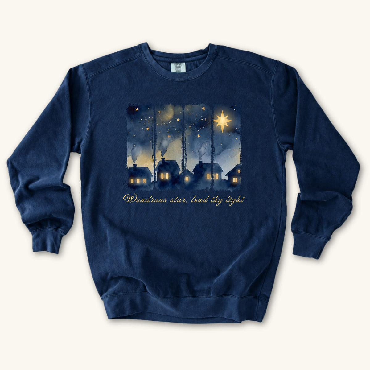 True Navy Christian Christmas sweatshirt with a painted village at night, glowing windows, a big golden star and Wondrous star, lend thy light in script.