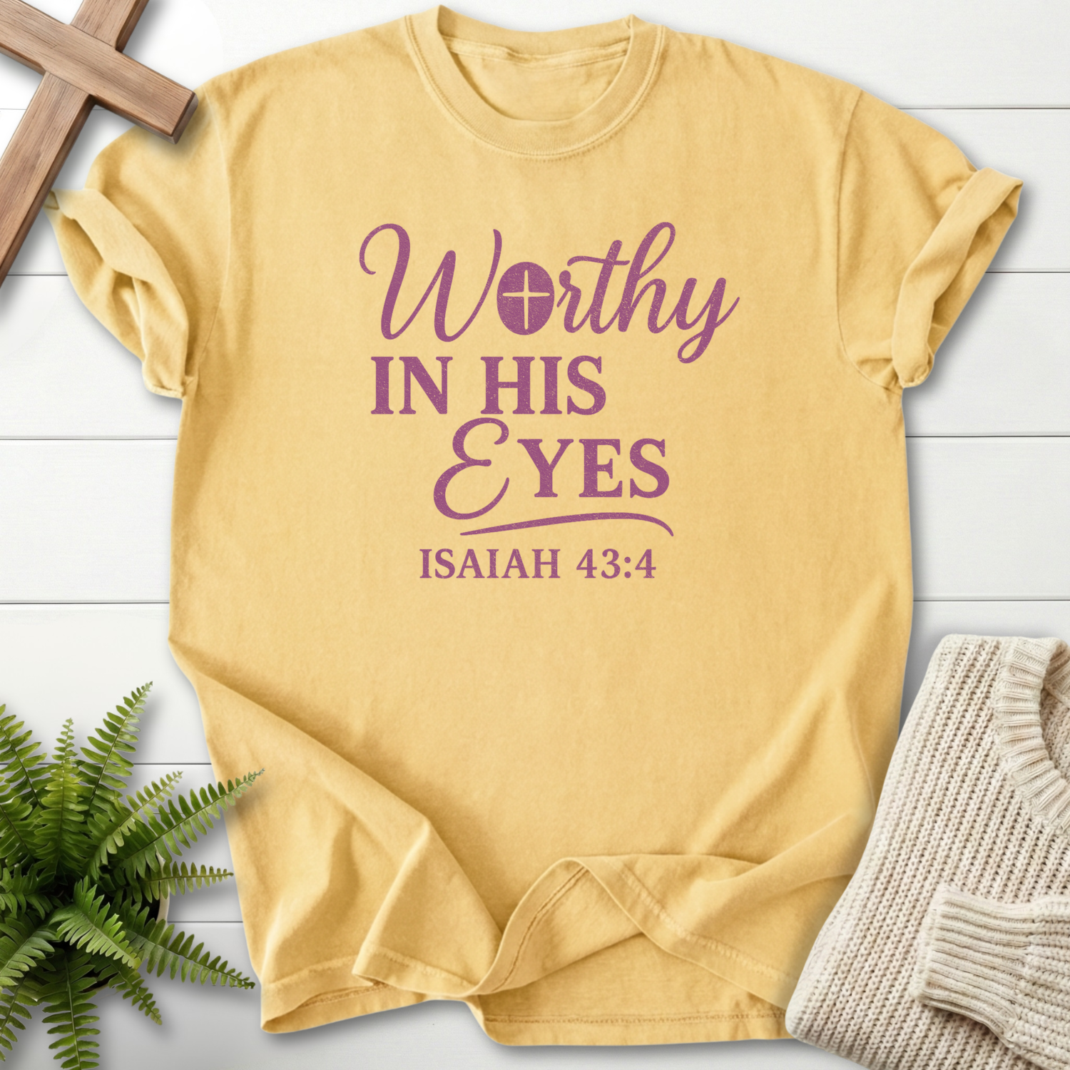 Butter faith-based tee with purple Worthy in His Eyes lettering and Isaiah 43:4 scripture, inspired by Isaiah 43:4.