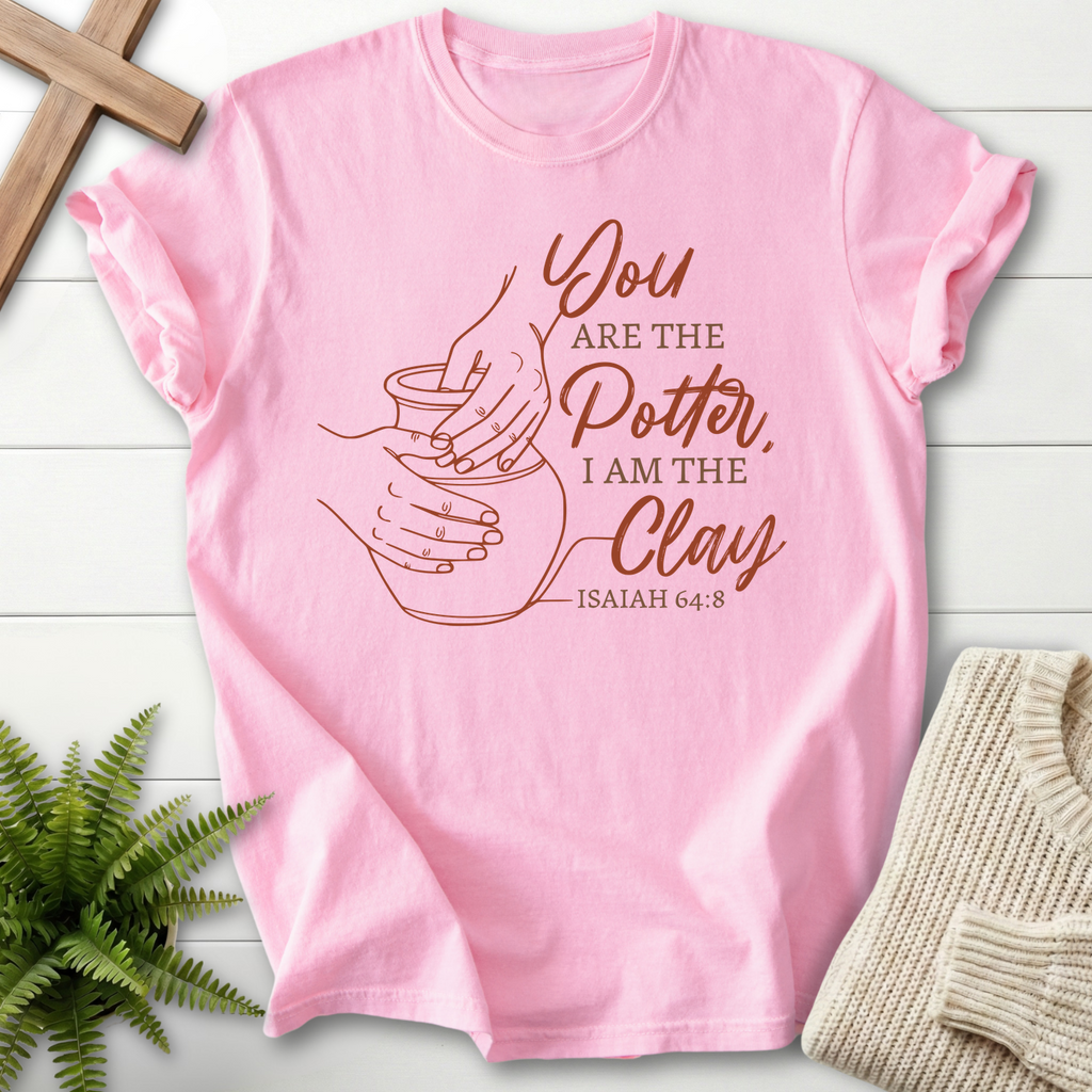 Blossom Bible verse tee with a terracotta potter and clay design, inspired by Isaiah 64:8.