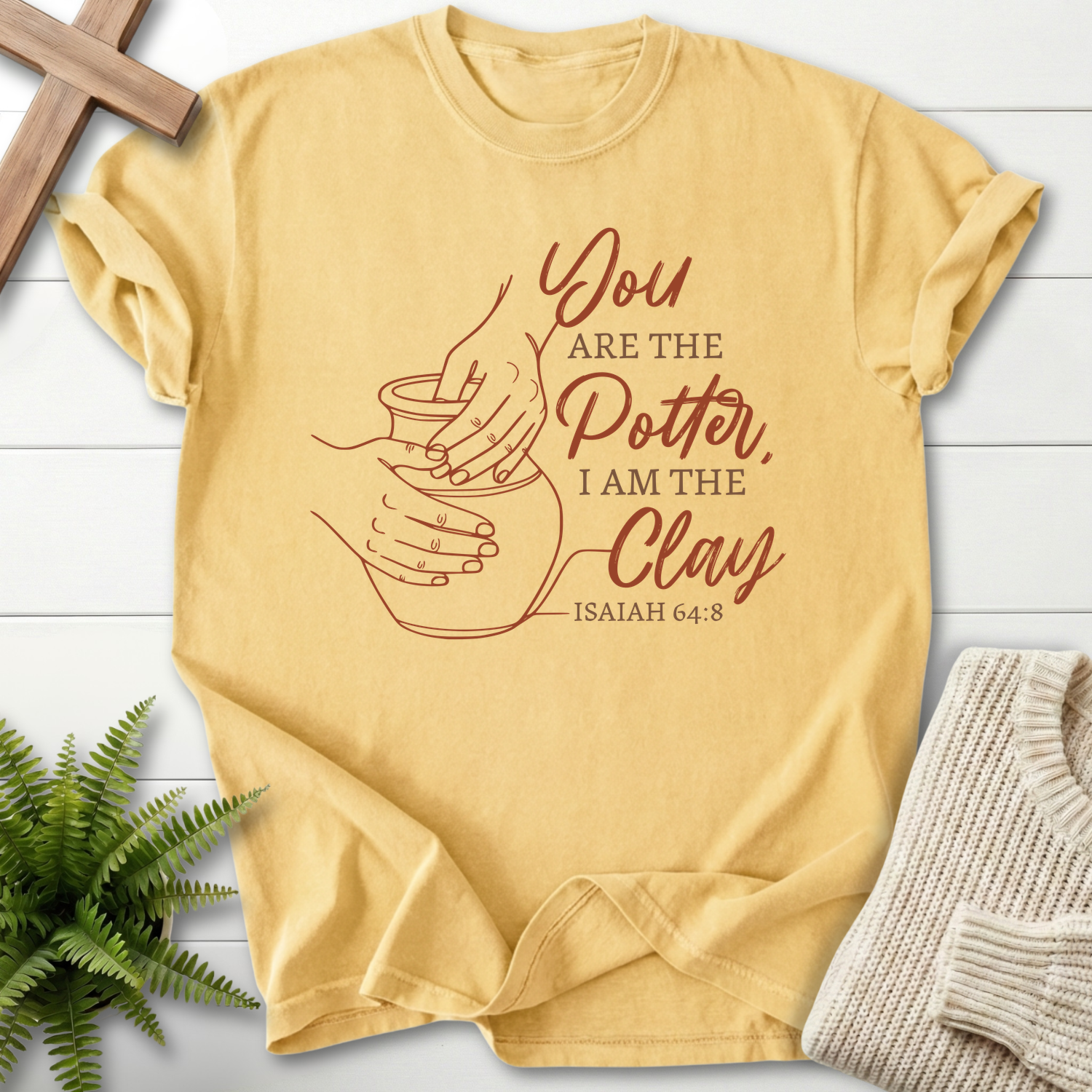 Butter Christian t-shirt for women with pottery wheel hands line art, inspired by Isaiah 64:8.