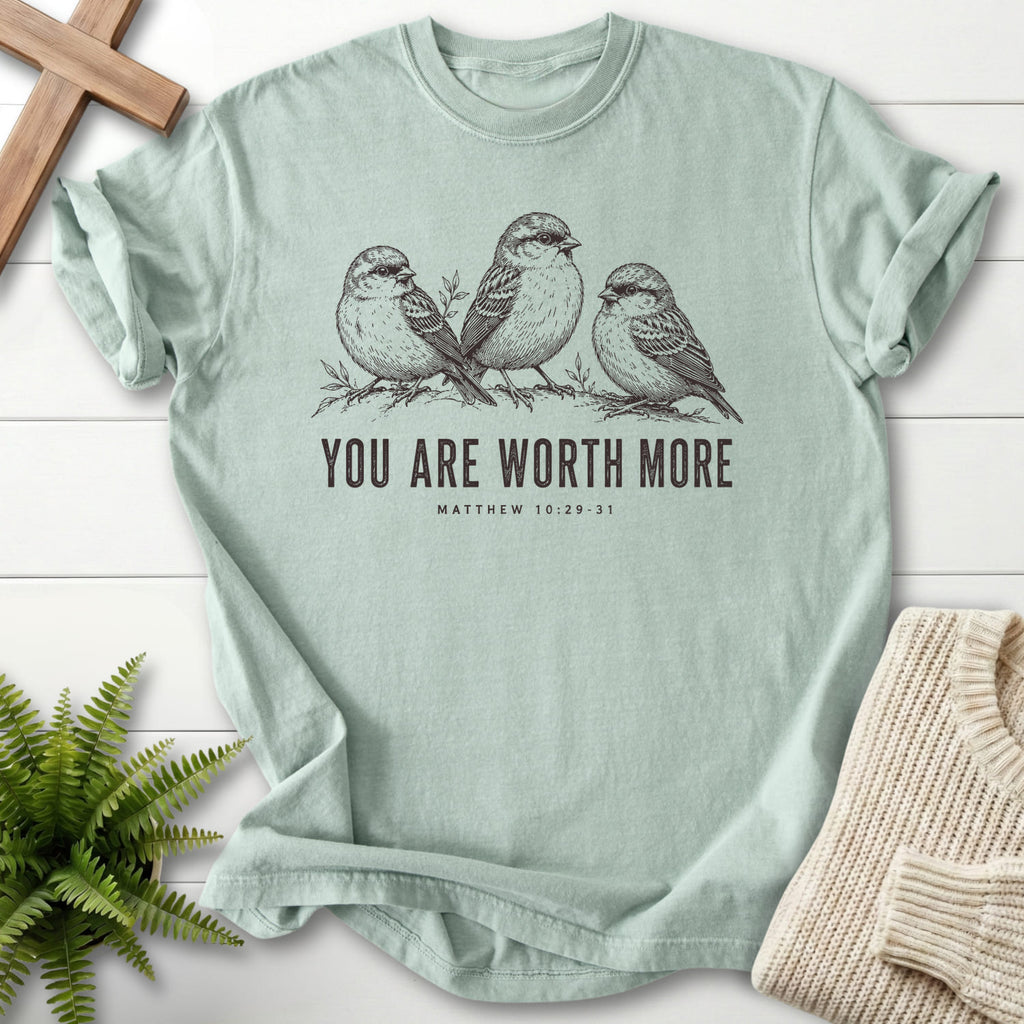 Flat lay of a Bay faith-based tee featuring "You Are Worth More Sparrows T-Shirt" design.