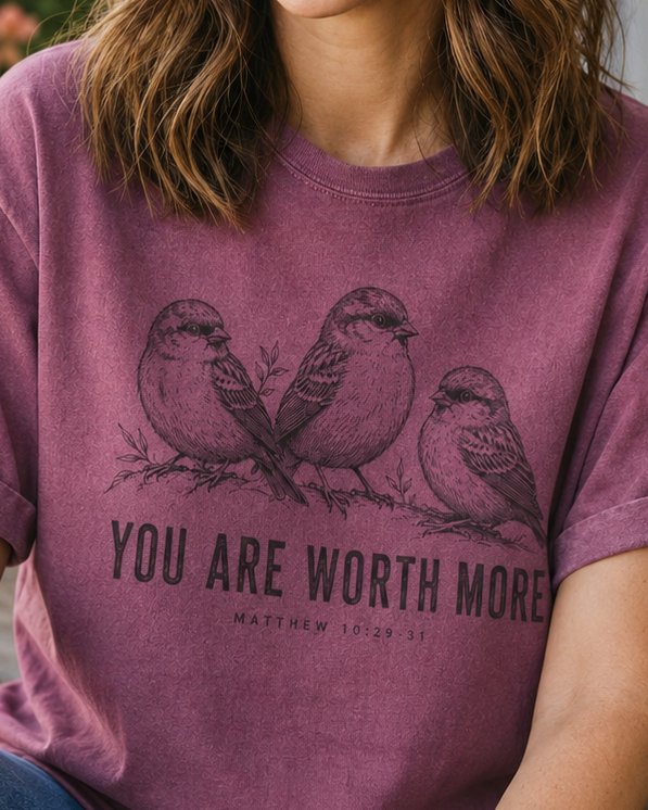 You Are Worth More Sparrows - Berry women's Christian tee, lifestyle photo in cottage doorway - Three engraved sparrows perched on a branch - Matthew 10:29-31 - She Wears Faith