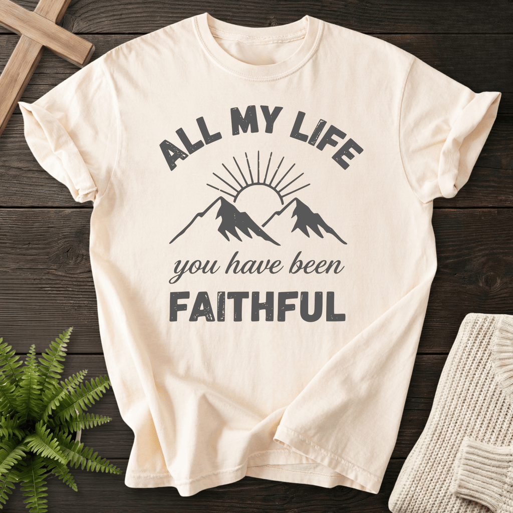 Ivory faith-based tee with a sun and mountain graphic and All My Life You Have Been Faithful text.