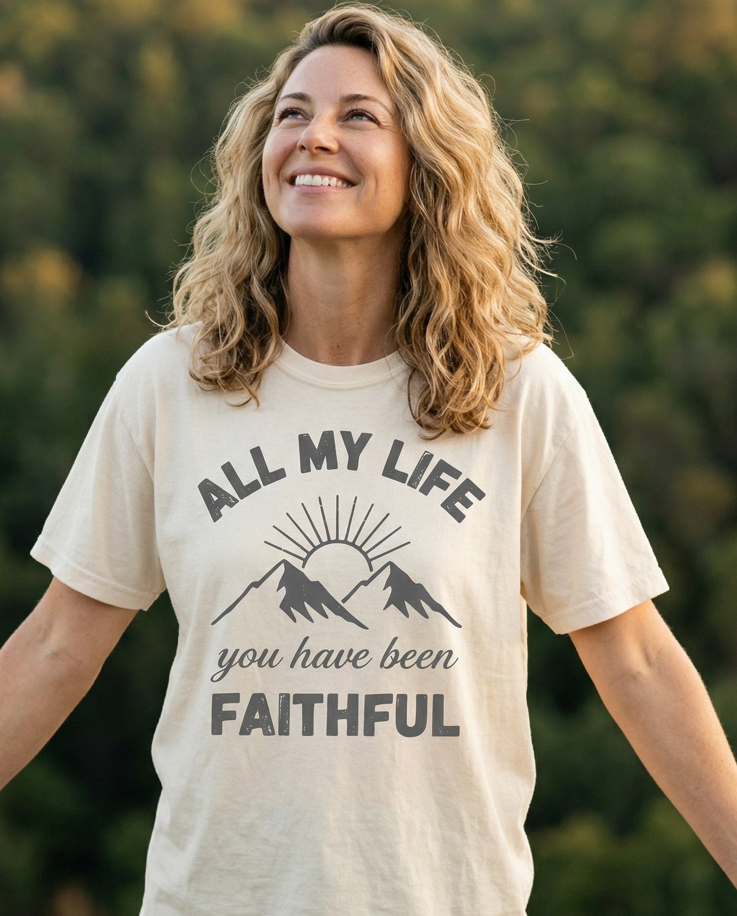 You Have Been Faithful – Ivory women's Christian tee, lifestyle photo in nature trail – Mountain and radiant sunrise graphic with arched bold text 'All My Lif – She Wears Faith
